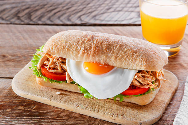 istock Sandwich with grilled meat egg tomato salad ciabatta 513375412