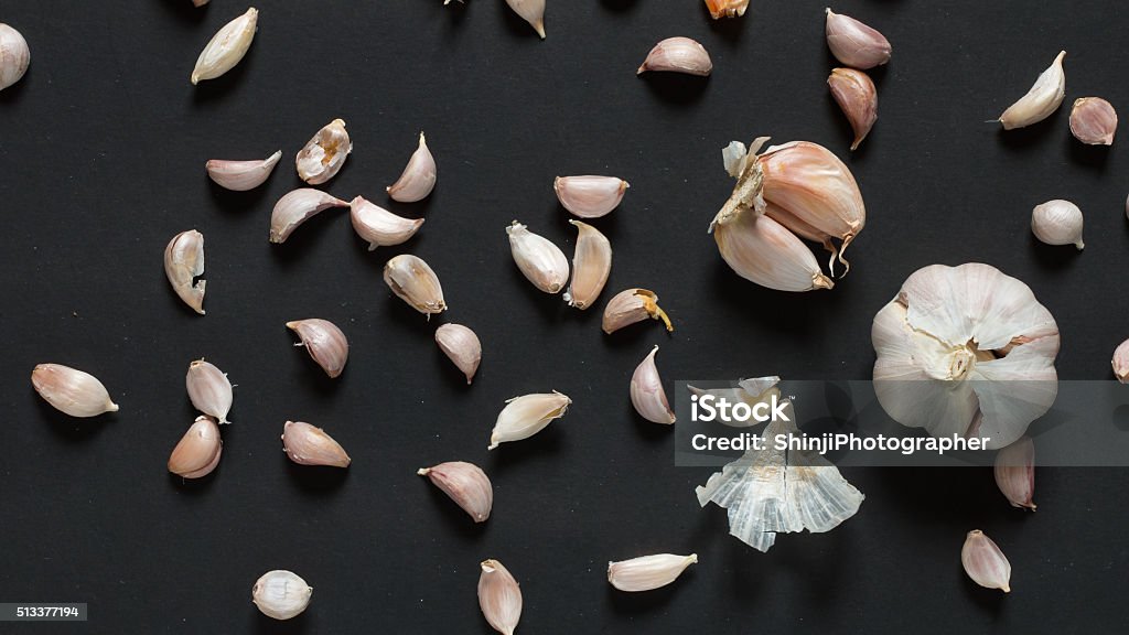 Garlic Garlic on black background from above,Flat ray design. Above Stock Photo