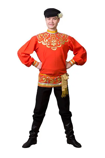 attractive caucasian guy wearing a russian folk costume isolated on white