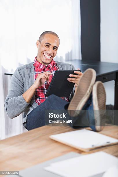 Young Man With Feet Up Stock Photo - Download Image Now - Business, Cardigan Sweater, Males