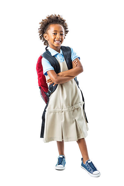 istock Cute kindergarten age girl wearing private school uniform and backpack 513379681