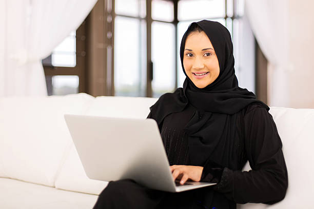 istock muslim woman using laptop 513380242
