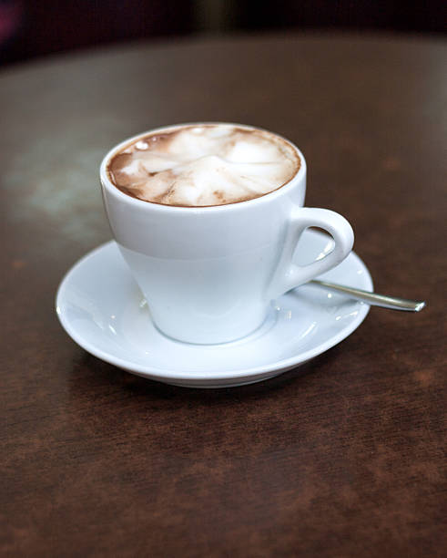 Breakfast: nice cup of coffee with cocoa and croissant