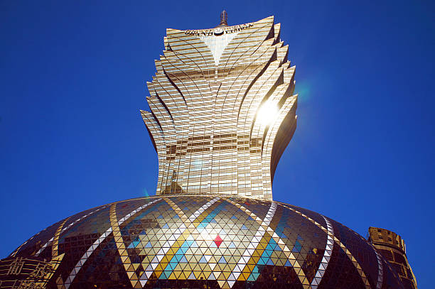 Macau, Macau S.A.R. - November 23, 2015: The facade of Grand Lisboa Macau casino resort, is the tallest luxury golden building in Macau Peninsula, China.
