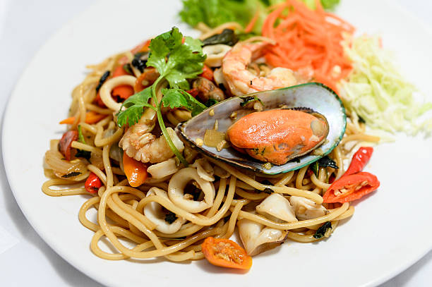 Spaghetti with spicy mixed seafood stock photo