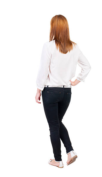 istock back view of walking  woman in jeans. 513382961