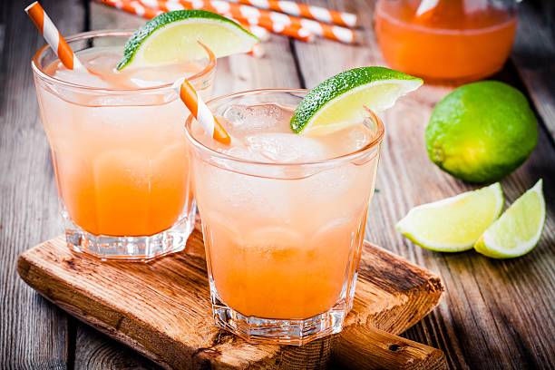 istock Tequila sunrise cocktail with ice and lime 513384982