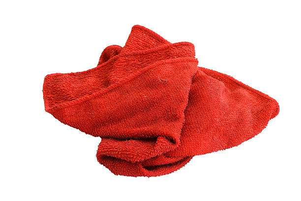 istock Dirty red cloth isolated on white background 513387162