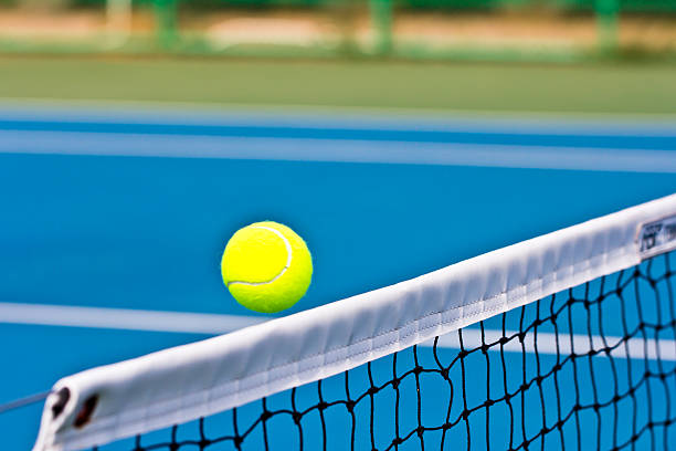 istock motion tennis ball over net 513389044