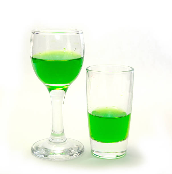 Glass with a colored liquid is isolated on a white background