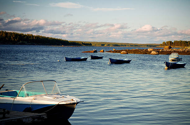 istock White Sea shore landscape with boats 513392349