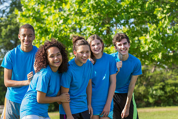 Teenagers Multi-ethnic group of teenagers (14 to 17 years).  Girl 2nd from left is physically challenged, an amputee. teenagers only teenager multi ethnic group student stock pictures, royalty-free photos & images