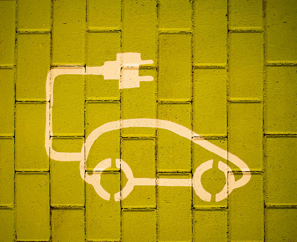 istock Electric car sign painted on street 513393390