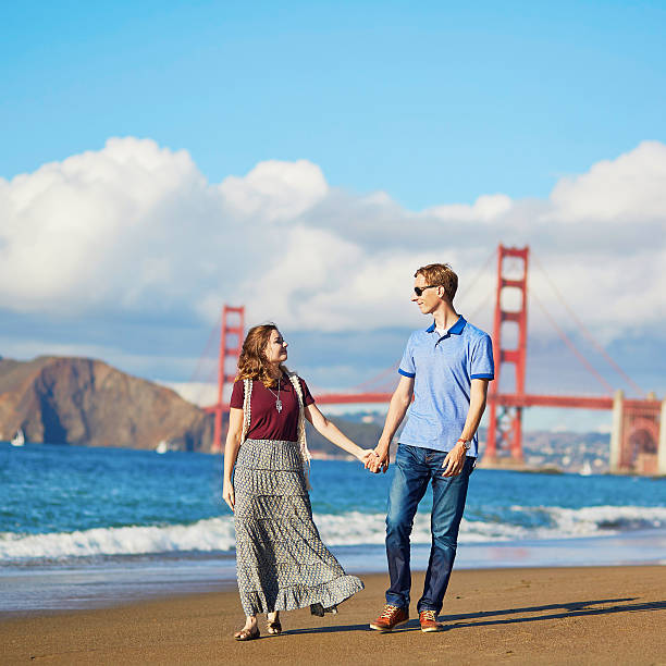istock Couple having a date on Baker beach in San Francisco 513393502