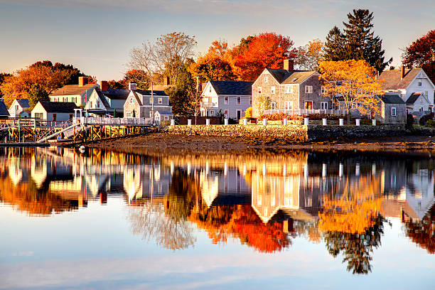 Autumn in Portsmouth, New Hampshire Autumn reflection along the Portsmouth New Hampshire waterfront.  It is a historic seaport and popular summer tourist destination. Portsmouth is the third oldest city in the USA. New  Hampshire is one of New England's most popular fall foliage destinations bringing out some of  the best foliage in the United States portsmouth nh stock pictures, royalty-free photos & images