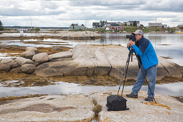 istock Photographer in Nova Scotia Bay at Low Tide 513394859