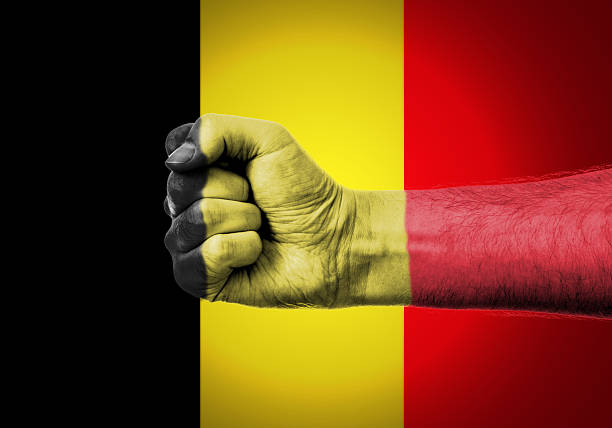 National flag of Belgium from thick colored smoke on a black isolated background