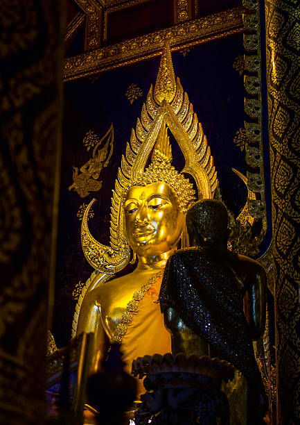 istock Golden buddha statue at Phisanulok in thailand 513396497