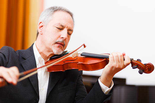 istock Musician playing his violin 513398805