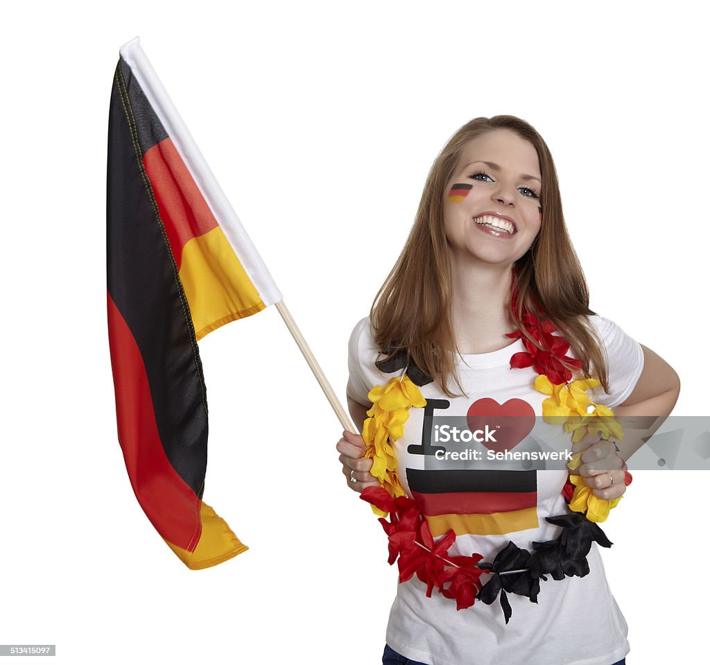 Smiling woman shows german flag Attractive woman shows german flag and smiles in front of white background Adult Stock Photo