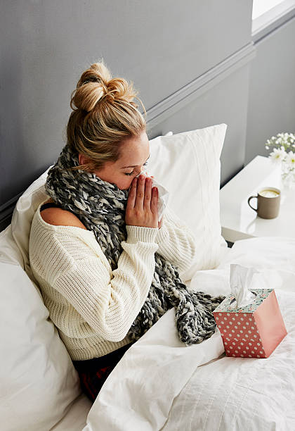 istock Girl in bed with cold 513415232