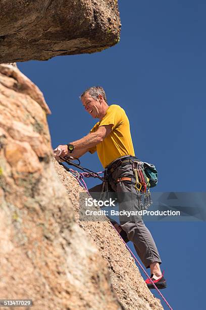 Senior Man At Top Of Rock Climb In Colorado Stock Photo - Download Image Now - Colorado, Rock Climbing, Active Lifestyle