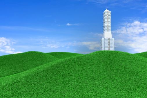 A skyscraper in a green Meadow. 3D rendered Illustration.