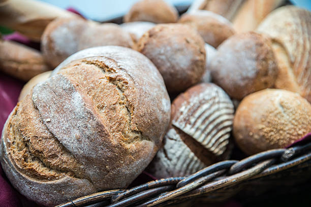 istock Delicious bread and rolls in basket 513417223