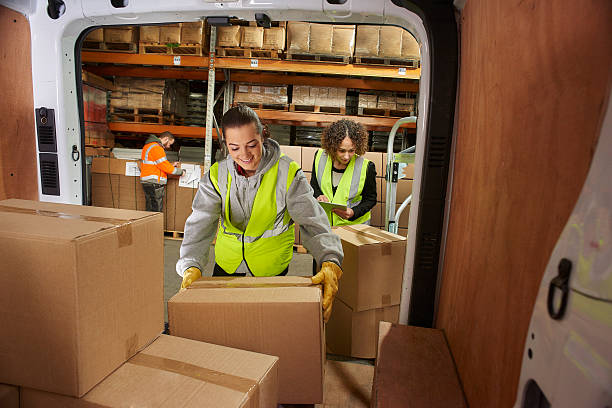 istock female courier filling her van 513417282