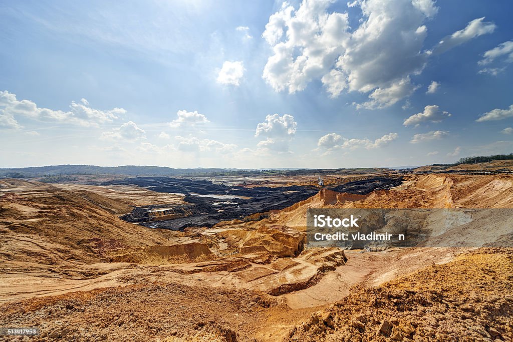 Open mining pit Open coal mining pit with heavy machinery Mining - Natural Resources Stock Photo