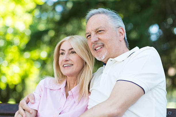 istock Happy couple sitting outdoors 513418892