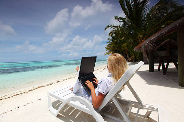 istock tropical business woman with laptop 513419313