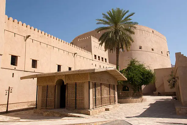 Empty courtyard with tower at the16th Century castle in Nizwa, Oman.