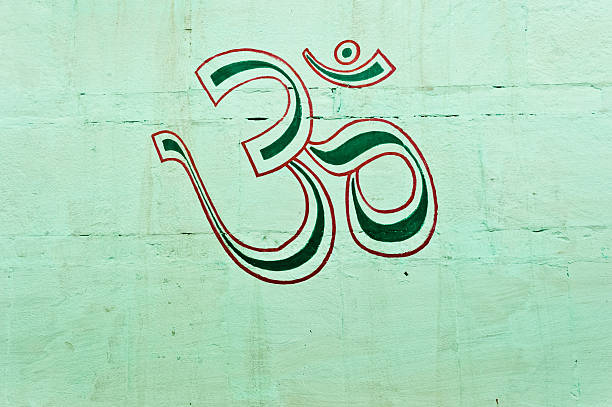 istock OM symbol painted on the wall, Varanasi, India 513419616