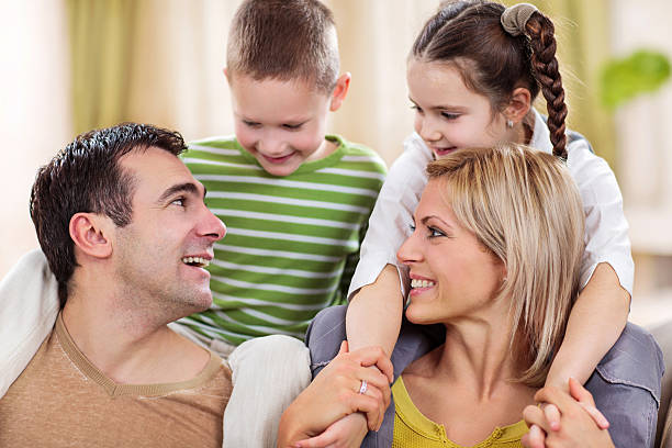 Happy parents enjoying their children.