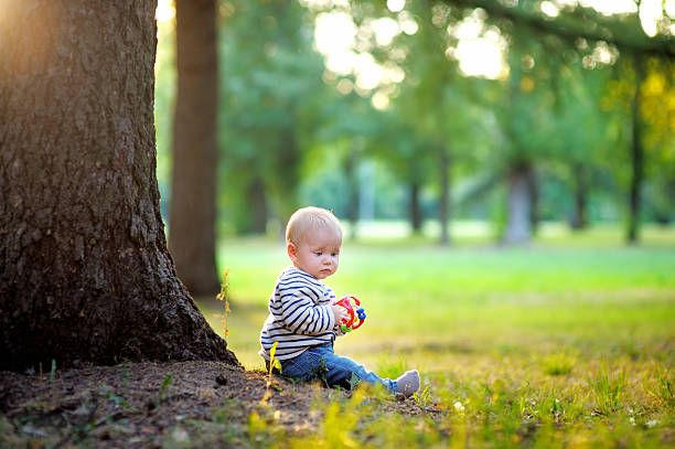 istock Little baby boy at the sunny park 513420597