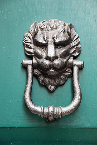 istock Medieval door knocker in a form of iron lion head 513420866