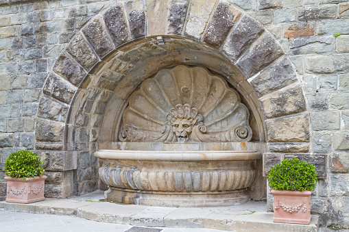 Decorative fountain in the main square of the small Tuscan town of Radda in Chianti