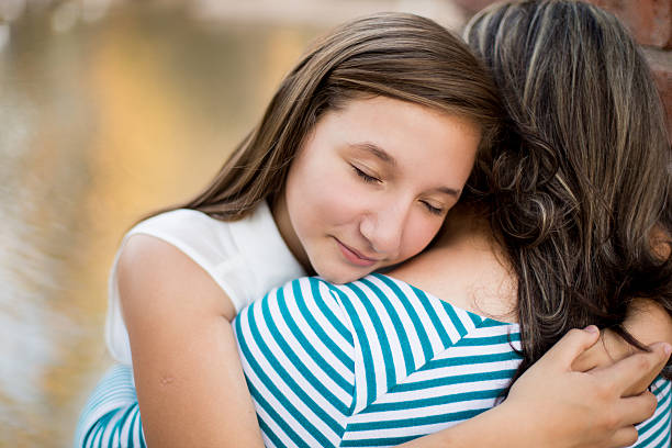 istock Hispanic girl hugging her mother 513423308