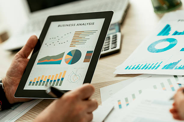 istock Teamwork with two business people in office with business analysis 513426176