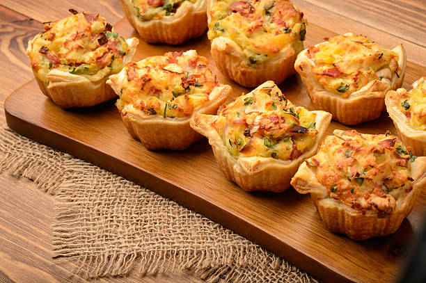 istock Tartlets baked with mashed potato, cheese, ham and parsley. 513427880