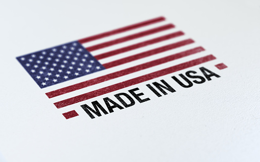 Made in USA Flag Barcode on white paper with selective focus.