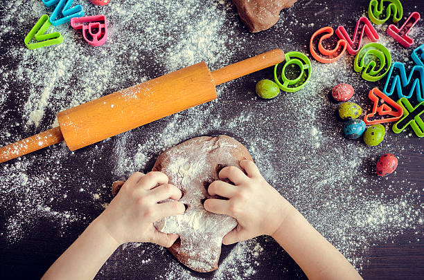 istock Young girl's hands kneading dough 513428940