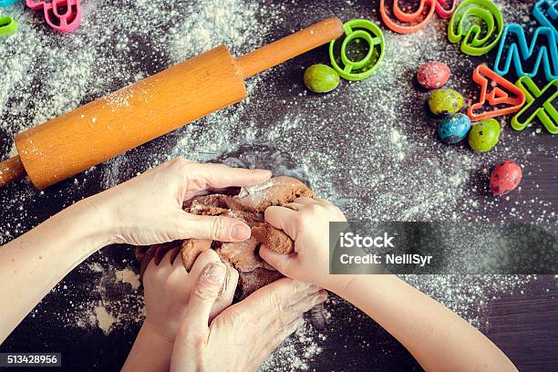 Mother Teaching Daughter How To Make Dough Stock Photo - Download Image Now - Child, Alphabet, Cookie