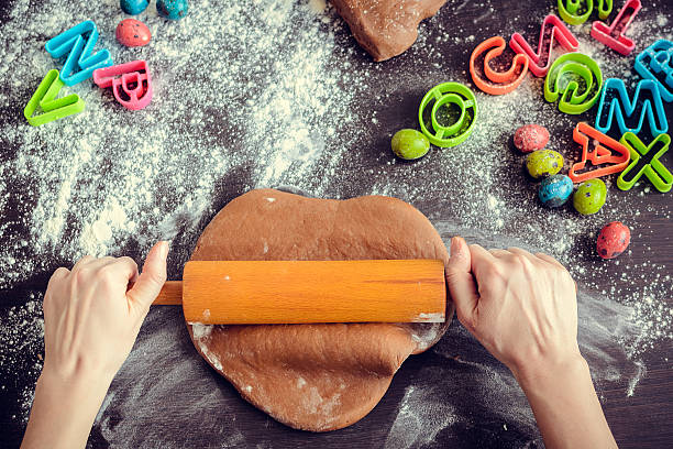 istock Woman's hands sheeting dough with rolling pin 513429134