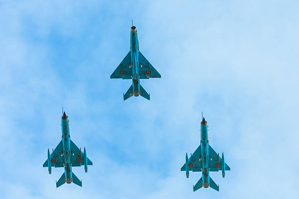 Bucharest, Romania - December 01, 2015:Formation of supersonic MiG-21 LANCER fighter performs a demonstrantion during the Romanian National Day.