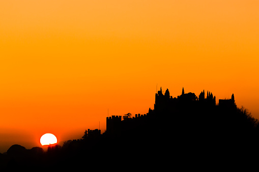 Castle silhouette at sundown. Italian panorama from \