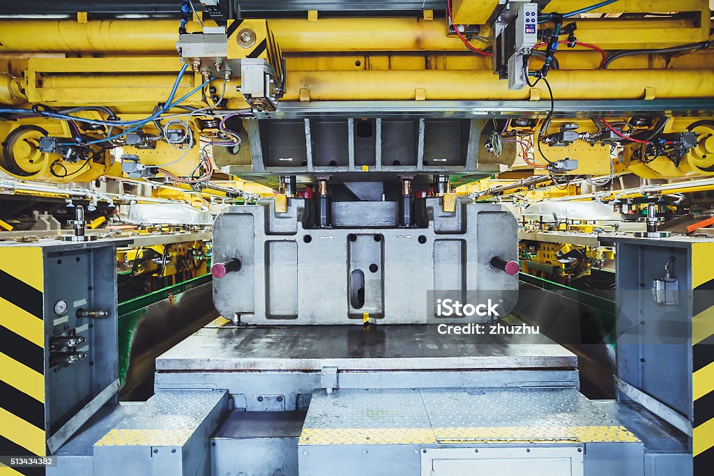 stamping line on car manufacture hydraulic press on car manufacture Hydraulic Platform Stock Photo