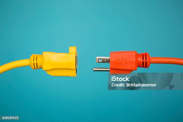 Yellow And Orange Electric Plug Stock Photo - Download Image Now - Electric Plug, Separation, Extension Cord