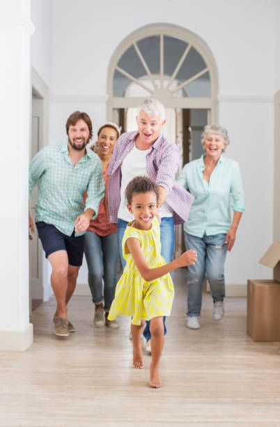 istock Family running through home together 513437957